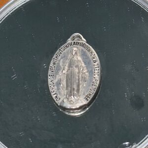 Our Lady of Grace oval silver tone medal pendant